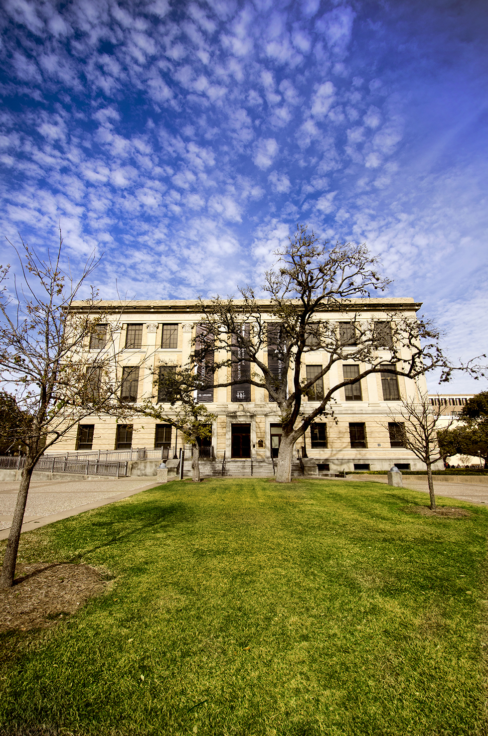 Custom building banners on Cushing Memorial Library to promote the event and exhibit
